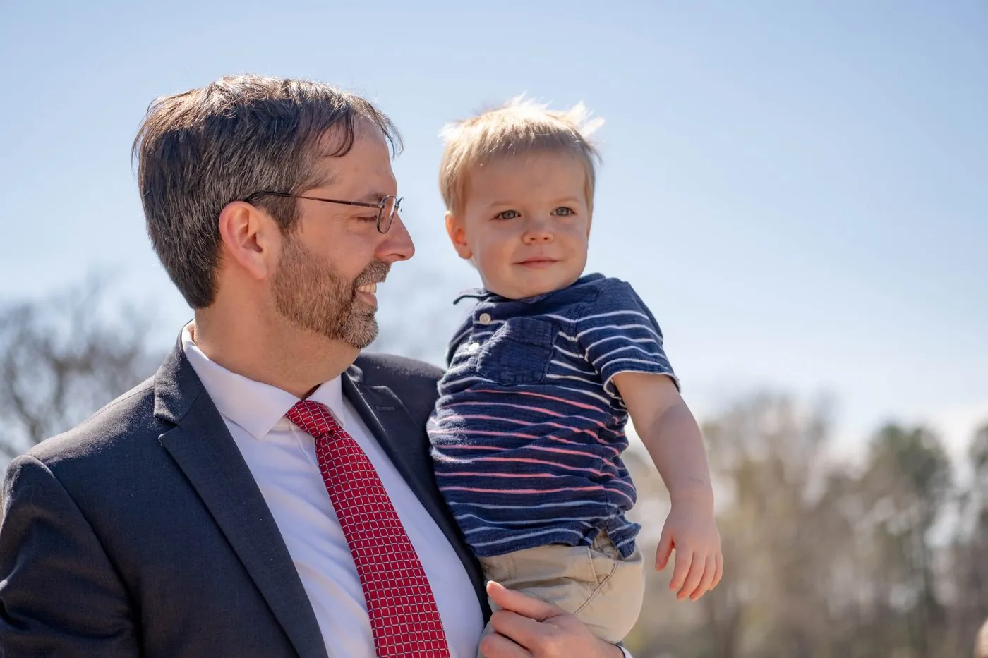 Shane Gottwals holding his young son